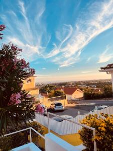a view from the balcony of a house with a car at The Throne in Alcabideche
