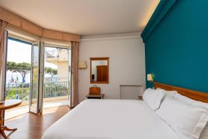 Posteľ alebo postele v izbe v ubytovaní Hotel Majestic by LVG Hotel Collection