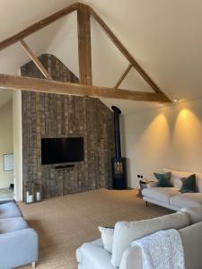 TV a/nebo společenská místnost v ubytování Converted Barn in Sibford Gower
