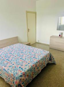 Ένα ή περισσότερα κρεβάτια σε δωμάτιο στο Casa Vacanza Aria di Mare +4 φωτογραφίες