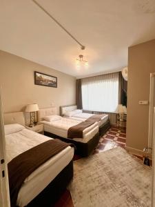 Una cama o camas en una habitación de Fındık Palas Otel
