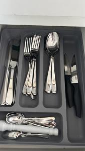 a tray with silver utensils in a drawer at Luxury 3 minutes from the Porto da Barra beach - Fast Wi-Fi, new apartment in Salvador +32 photos