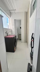 a room with a bathroom with a tub and a sink at Luxury 3 minutes from the Porto da Barra beach - Fast Wi-Fi, new apartment in Salvador