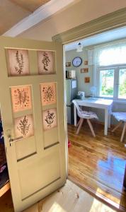 a room with a door and a table in a room at Bezvējš in Jūrmala +10 photos