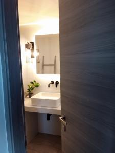 a bathroom with a sink and a mirror at Santa Rosa house in Lichnaftia +23 photos