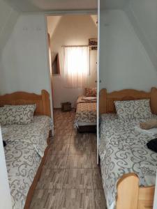 Postel nebo postele na pokoji v ubytování Vikendica Drinski mir