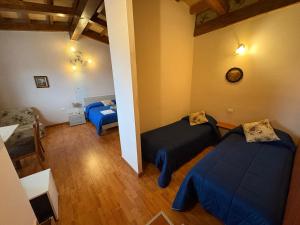 A bed or beds in a room at B&B Da Luca