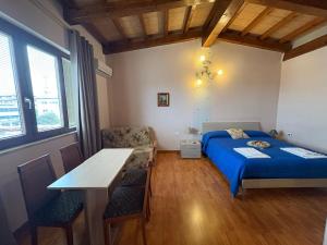 A bed or beds in a room at B&B Da Luca