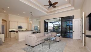 a living room with a couch and a table at Shenandoah in Marco Island
