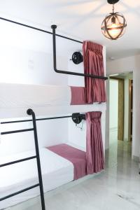 Ένα ή περισσότερα κρεβάτια σε δωμάτιο στο Qantic Lodging & Rooftop