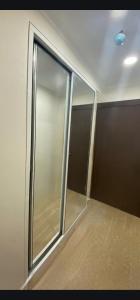 an empty room with a sliding glass door at Orbi Beach Tower in Batumi