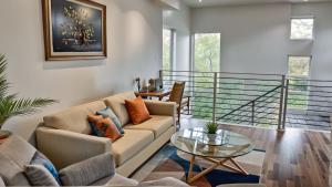 a living room with a couch and a table at Hollywood Homes Free parking close to all things LA in Los Angeles