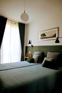 Ένα ή περισσότερα κρεβάτια σε δωμάτιο στο Tuscan Country House Monastero