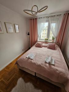 Posteľ alebo postele v izbe v ubytovaní Apartament Dworzec PKP