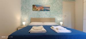 Postel nebo postele na pokoji v ubytování Onda Marina 2