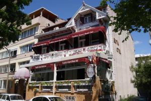 a building with red awnings on the side of it at Yeşilköy Airport Hotel in Istanbul