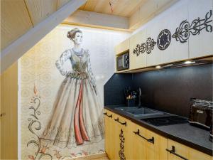 Kuchyňa alebo kuchynka v ubytovaní Apartamenty Małe Ciche z jacuzzi ogrodowym, widokiem na TATRY i SKY WALK