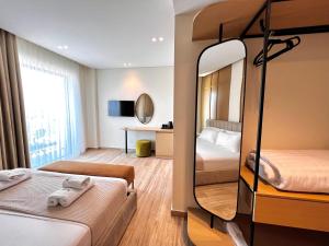 Postel nebo postele na pokoji v ubytování Avenue Hotel