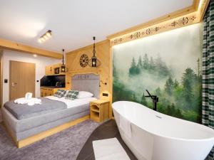Posteľ alebo postele v izbe v ubytovaní Apartamenty Małe Ciche z jacuzzi ogrodowym, widokiem na TATRY i SKY WALK