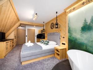 Posteľ alebo postele v izbe v ubytovaní Apartamenty Małe Ciche z jacuzzi ogrodowym, widokiem na TATRY i SKY WALK