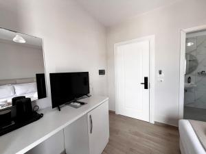 TV a/nebo společenská místnost v ubytování Avenue Hotel