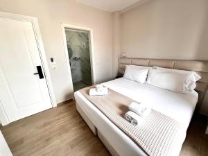 Postel nebo postele na pokoji v ubytování Avenue Hotel