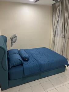 Postel nebo postele na pokoji v ubytování Homestay Jiejie Putrajaya P16 Wifi Netflix