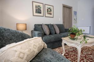 a living room with a couch and a table at Kotrona Apartments in Kalavrita