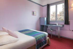 Postel nebo postele na pokoji v ubytování Best Western Hotel Le Guilhem