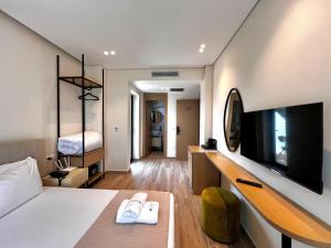 TV a/nebo společenská místnost v ubytování Avenue Hotel