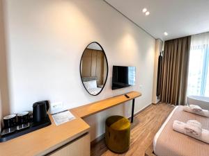 Postel nebo postele na pokoji v ubytování Avenue Hotel