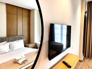 TV a/nebo společenská místnost v ubytování Avenue Hotel