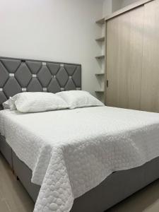 Postel nebo postele na pokoji v ubytování Apartahotel Centro 101 Edificio PF7 primer piso