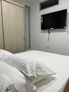 Postel nebo postele na pokoji v ubytování Apartahotel Centro 101 Edificio PF7 primer piso