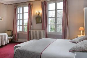 Postel nebo postele na pokoji v ubytování Best Western Hotel Le Guilhem