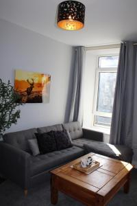 a living room with a couch and a coffee table at Trendy Apartment in Tralee in Tralee