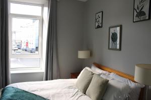 a bedroom with a bed and a window at Trendy Apartment in Tralee in Tralee