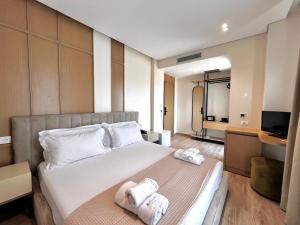 Postel nebo postele na pokoji v ubytování Avenue Hotel