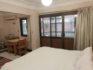 Ένα ή περισσότερα κρεβάτια σε δωμάτιο στο fayrouz apartment