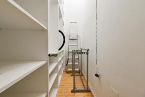 a room with a ladder next to a staircase at Luxory in Sofia +5 photos
