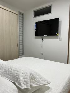 Postel nebo postele na pokoji v ubytování Apartahotel Centro 101 Edificio PF7 primer piso