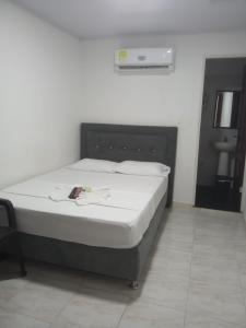 a bedroom with a bed in a room at Hotel Urdaneta AV in Neiva