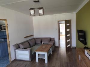 a living room with a couch and a table at apt Maria in Medzilaborce
