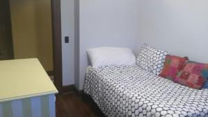 a bed with two pillows on it in a room at 3 Bedroom House 2 Bath House Near New York in Clifton +1 photo