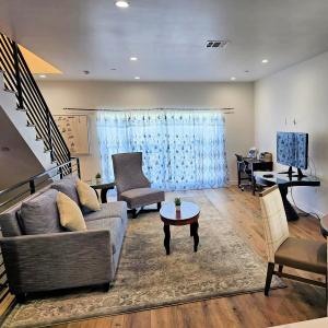 a living room with a couch and a table at Hollywood Homes Free parking close to all things LA in Los Angeles