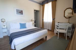 Posteľ alebo postele v izbe v ubytovaní Hotel Villa Erica