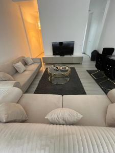 Khu vực ghế ngồi tại Modernes City Apartment am Limbecker Platz Essen