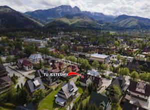 an aerial view of a town with mountains in the background at Willa Michalowka in Zakopane +15 photos