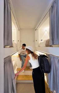 Ένα ή περισσότερα κρεβάτια σε δωμάτιο στο Casa Helena Hostel