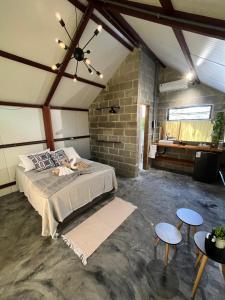 Ένα ή περισσότερα κρεβάτια σε δωμάτιο στο Cabanas Saruê - Ninho